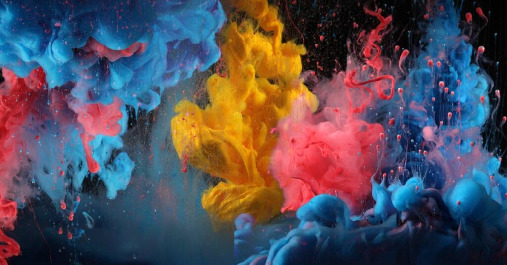 Several "explosions" of colors burst underwater in the following sequence: red, blue, yellow, red, and blue.